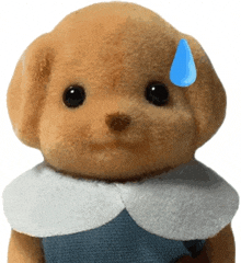 a stuffed animal with a blue tear coming out of its nose