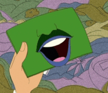 a person is holding a green piece of paper with a mouth on it