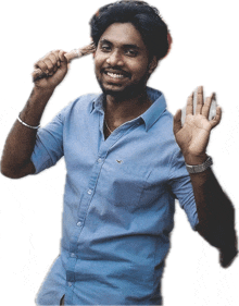 a man wearing a blue shirt with a hollister logo on the front