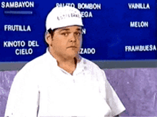 a man wearing a hard hat is standing in front of a menu that says sambayon