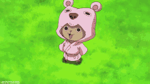 a cartoon character wearing a pink bear costume is standing in the grass