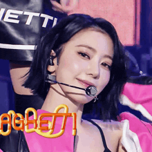 a close up of a woman wearing a microphone with the word jett on the bottom left