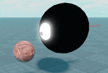 a sphere with a face on it is next to a black sphere with a light coming out of it