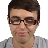 a close up of a man wearing glasses and a gray shirt