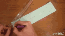 a ruler is being used to measure a piece of paper