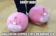 a person wearing pink slippers that say sorry babe