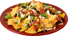 a red plate topped with nachos and vegetables