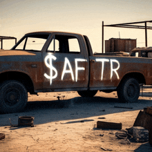 a rusty truck with a dollar sign painted on the side