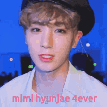 a close up of a person 's face with the words mimi hyunjae 4ever above it