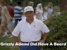 a man wearing a white shirt and a white hat with the words grizzly adams did have a beard above him