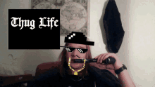 a man wearing sunglasses and a hat with the words thug life written on it