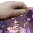 a close up of a person 's hand holding a purple object over a person 's head .