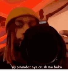 a man is taking a picture of himself with a camera and says `` ay pinindot nya crush mo bako '' .