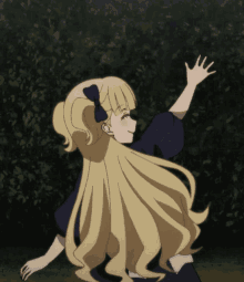 a girl with long blonde hair and a bow in her hair reaches out her hand