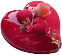 a heart shaped cake with a rose on top