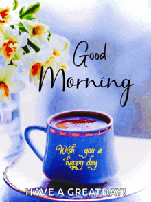 a blue cup of coffee with the words good morning wish you a happy day on it