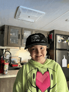 a girl wearing a hat that says camping hair don 't care