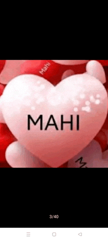 a white heart with the word mahi written on it is surrounded by red hearts .