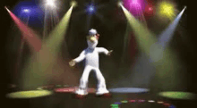 a cartoon chicken is dancing on a disco floor in front of a stage .