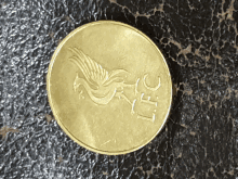 a gold coin with a bird on it and the number 30 on it