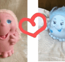 a pink toy and a blue toy with a red heart in the background