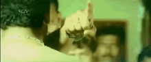 a close up of a person 's hand with a sgv digital logo on it .