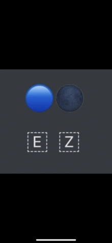 a phone screen shows a blue ball and a blue moon with e and z written below them