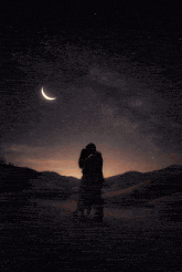 a man and a woman are dancing in the desert with a crescent moon in the background