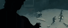 a group of people are playing a game in a dark room with a man wearing a virtual reality headset .