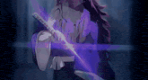a person is holding a sword with a purple light coming out of it in a dark room .