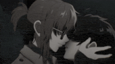 a black and white image of a woman kissing a man on the forehead