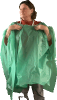 a woman is wearing a green plastic poncho over her shoulder