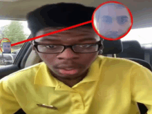 a man wearing glasses and a yellow shirt has a red circle around his head with a picture of another man behind him