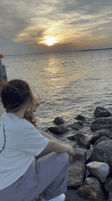 a woman wearing a white t-shirt that says ' i 'm sorry ' on it