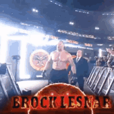 a wrestler named brock lesnar is walking through a ring