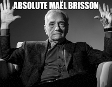 a man sitting in a chair with his hands in the air and the caption absolute mael brisson above him