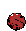 a pixel art drawing of a red ball with a face on it .