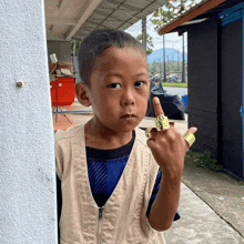 a young boy with a ring on his finger