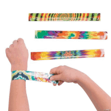 a person is wearing a tie dye wristband