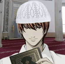 a man wearing a white hat holds a book in a mosque