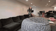a person is jumping over a bean bag chair