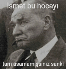 a black and white photo of a man with the caption ismet bu hocayi tam asamamissiniz sanki