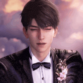 a man in a suit with a bow tie and a flower pin