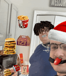 a man wearing a santa hat is surrounded by food