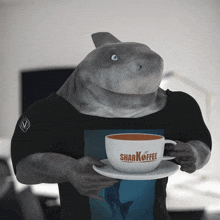 a shark is holding a cup of sharkcoffee