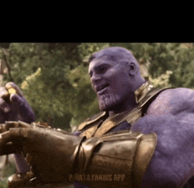 a video of thanos from avengers infinity war with the pinata farms app on the bottom right