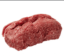 a pile of ground beef on a white surface