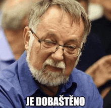 a man with glasses and a beard has the word je dobastino above his head