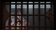 a girl with red eyes is behind bars in a cage