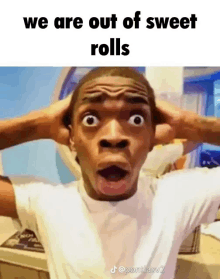 a man is covering his ears with his hands and making a funny face with the words `` we are out of sweet rolls '' .